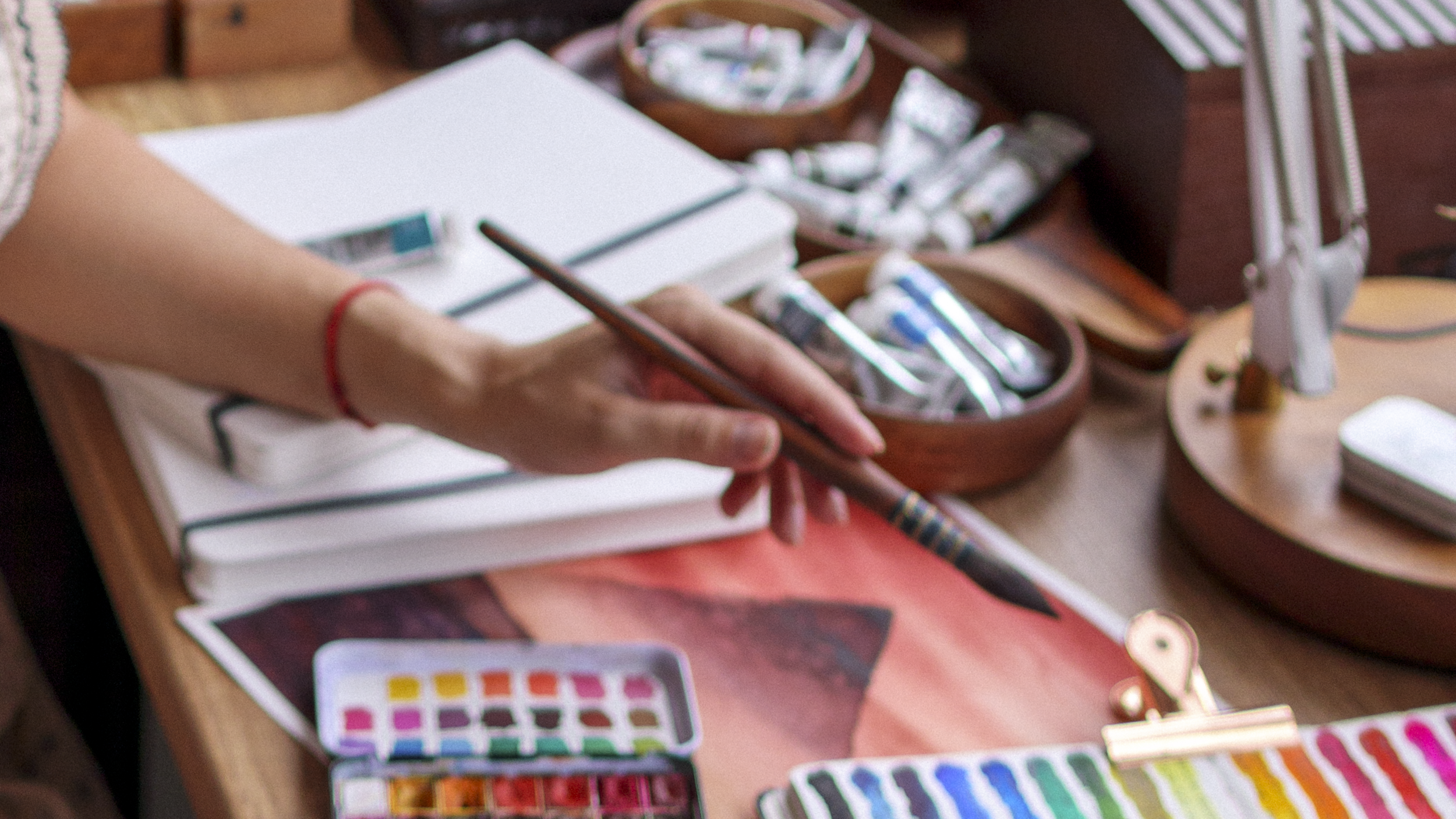 An aesthetic shot of a hand holding a brush