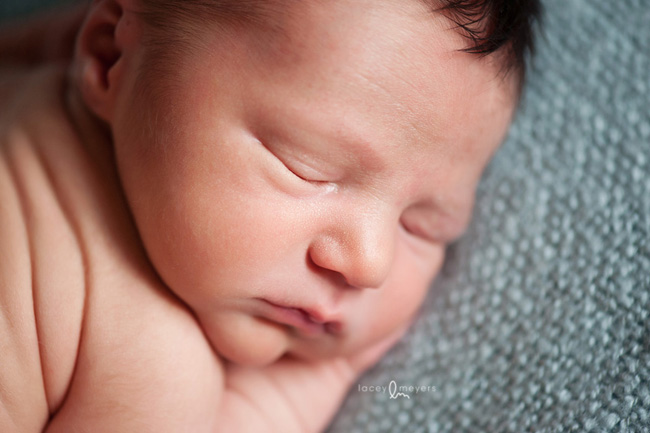 newborn baby on blue blanket
