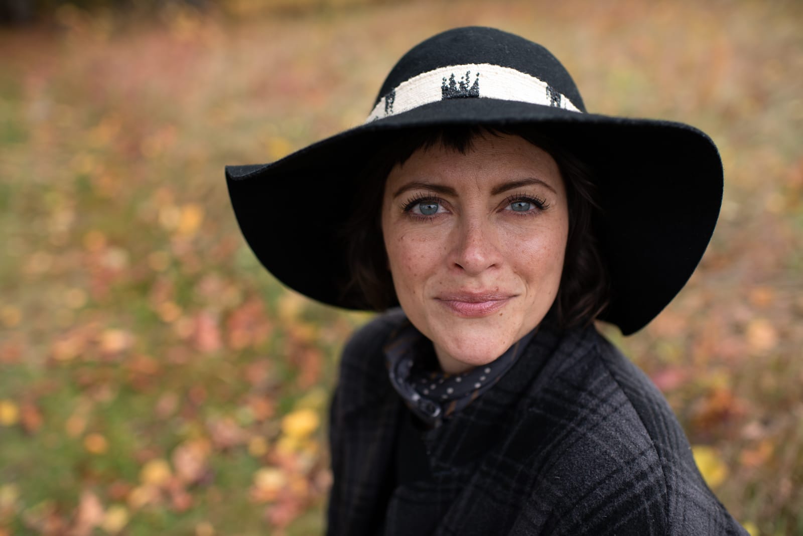 portrait of a woman in a black hat