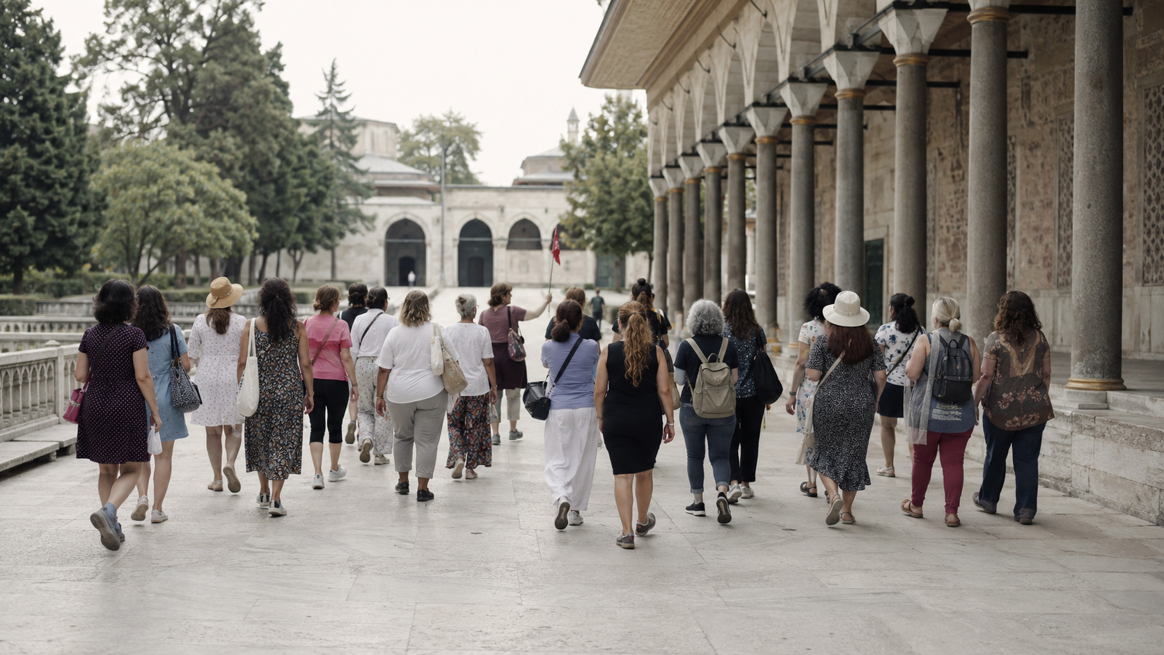 A large tour group following a guide through a crowded plaza, showing what conventional group travel looks like.