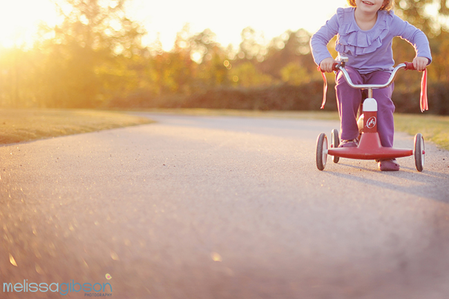child on bike during golden hour find your photography style