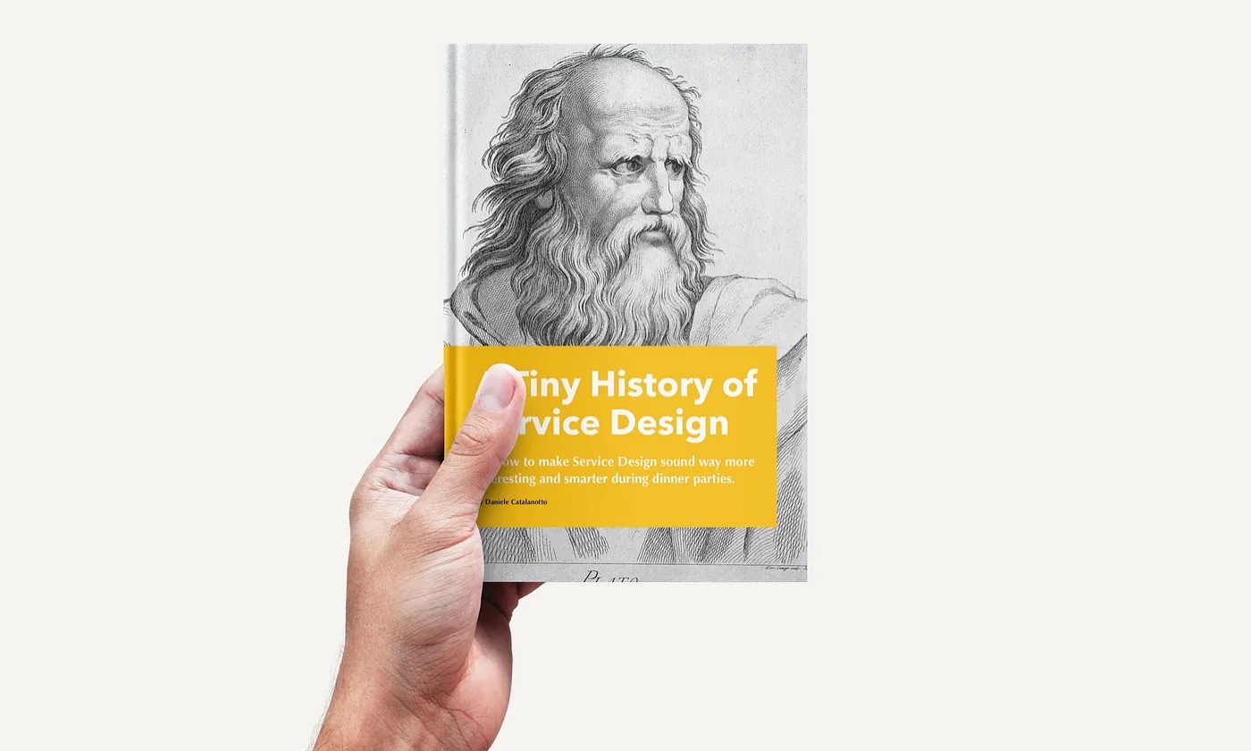 The book A Tiny History of Service Design in a hand