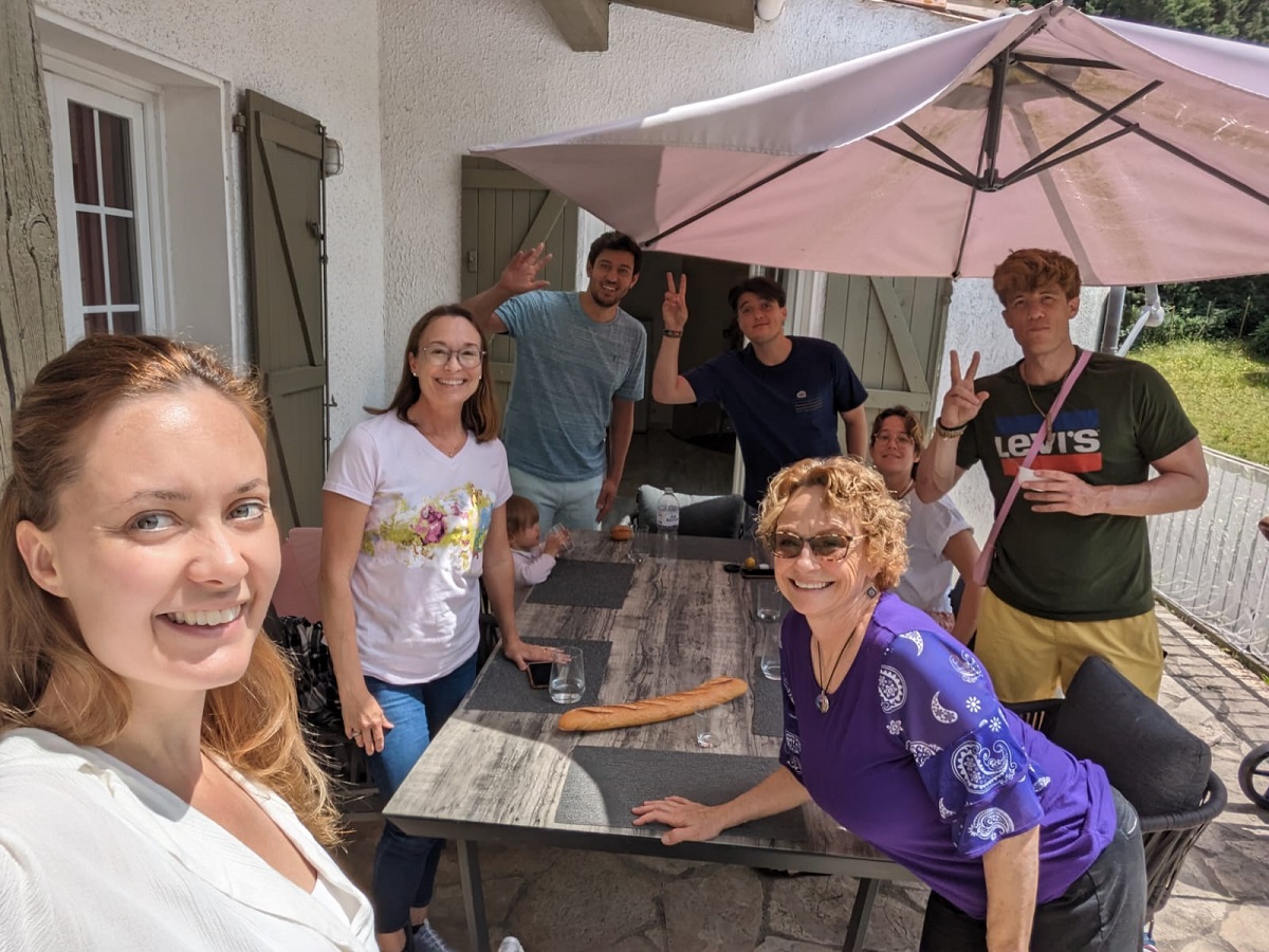 French immersion in Occitanie: Eliane sharing a homemade meal with her students while practicing French conversation.