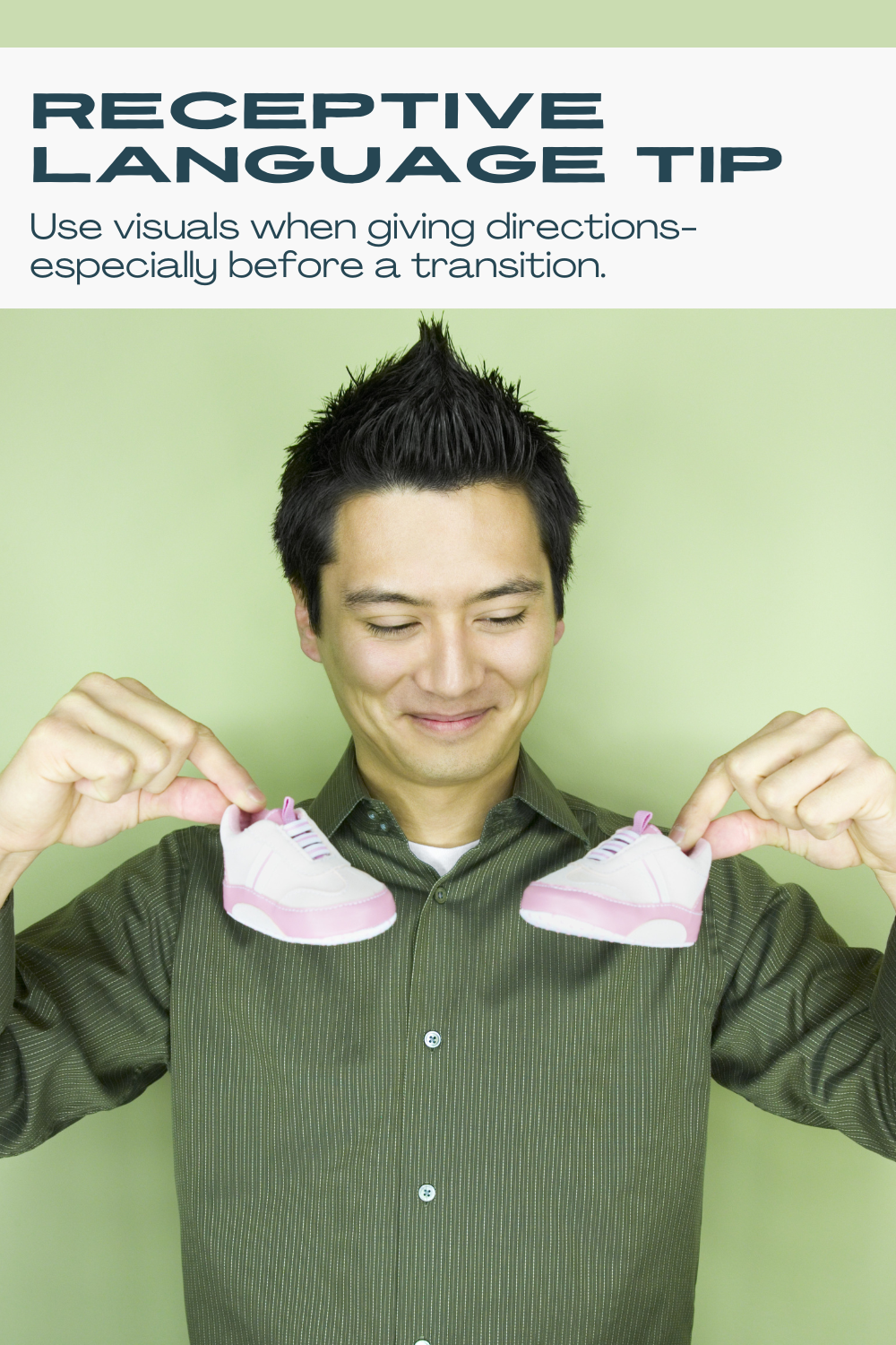 Parent holding a visual at a transition time to support receptive language skills