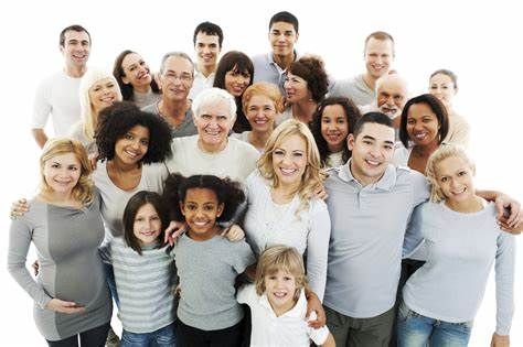 A diverse group of joyful people smiling and standing together, representing connection, fulfillment, community, and the power of joy.