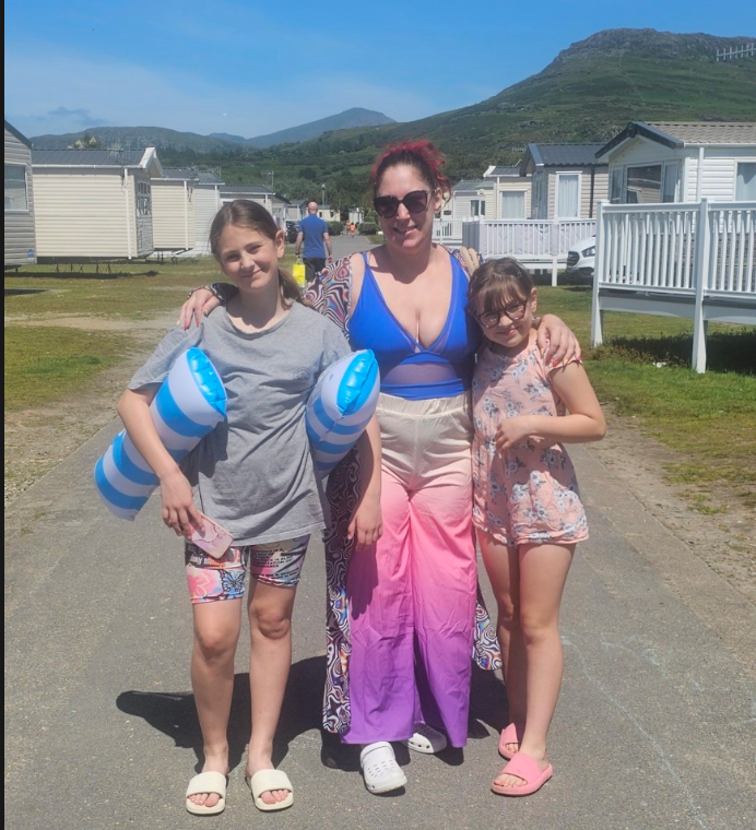 Michelle and her daughters on their summer caravan holiday – a reminder that exhaustion can exist even when life looks good on the outside