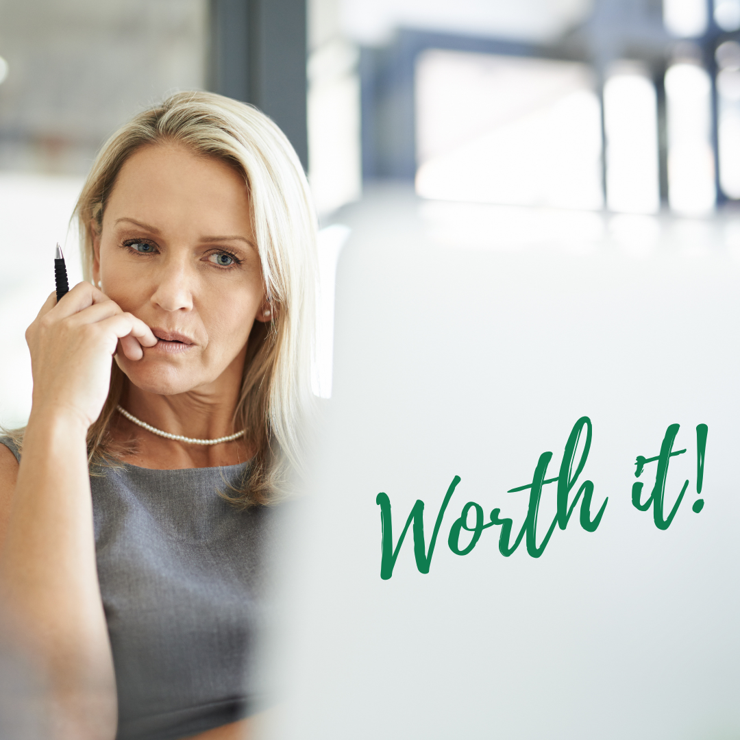 Thoughtful woman at her laptop with “Worth It” written across the image.