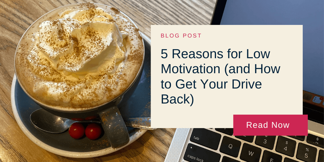 Cup of cappuccino with whipped cream and cinnamon on a wooden table beside a laptop. Overlay text reads: "Blog Post: 5 Reasons for Low Motivation (and How to Get Your Drive Back). Read Now."