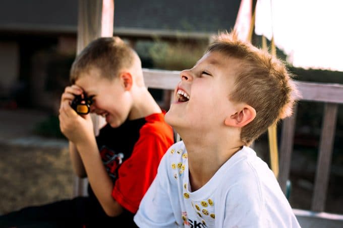 boys laughing in candid photo