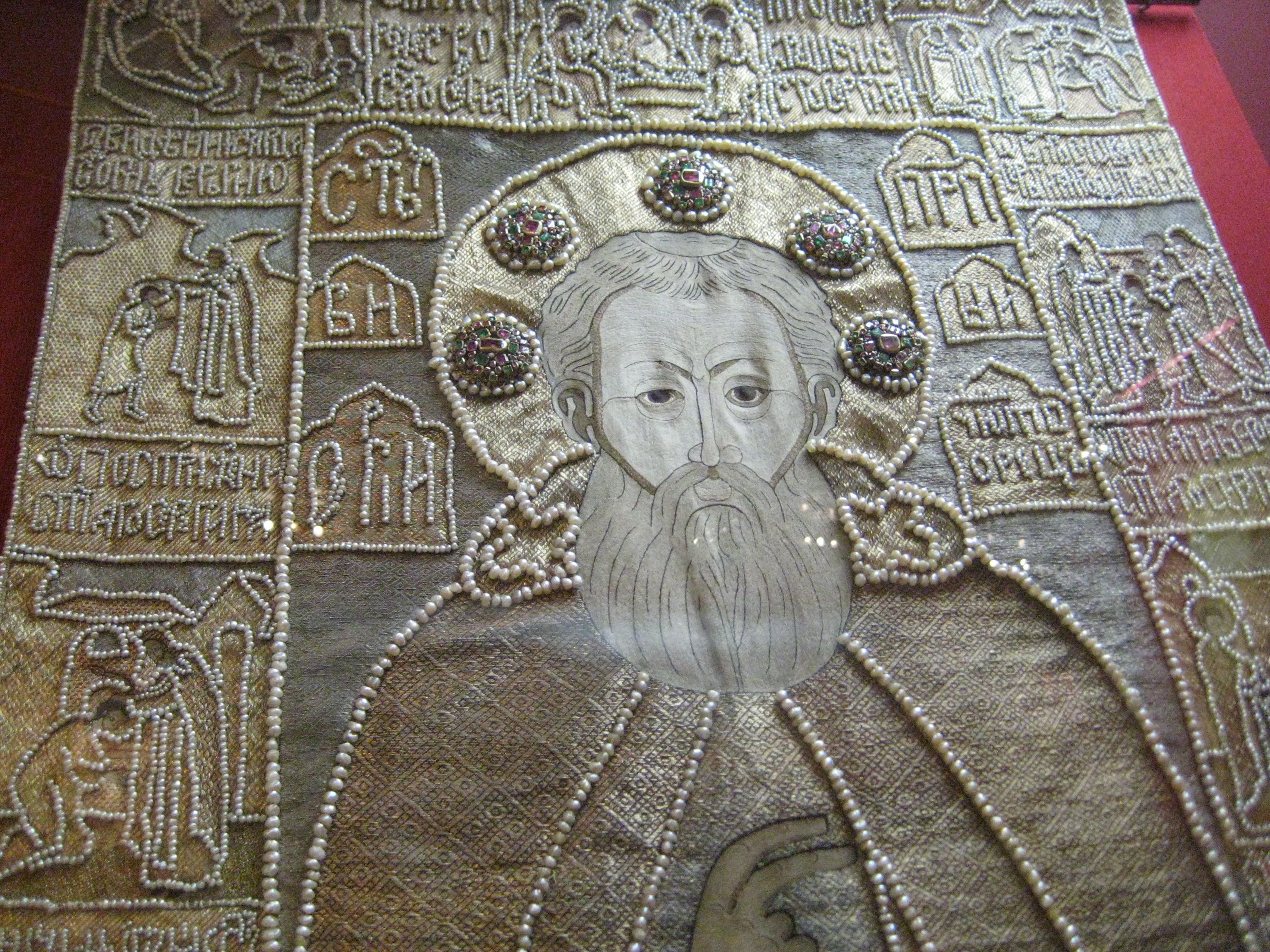 Stroganov Family Pelena (1667) - A cross embroidered entirely with pearls, creating a mosaic-like design on a velvet background, further enhanced by gems