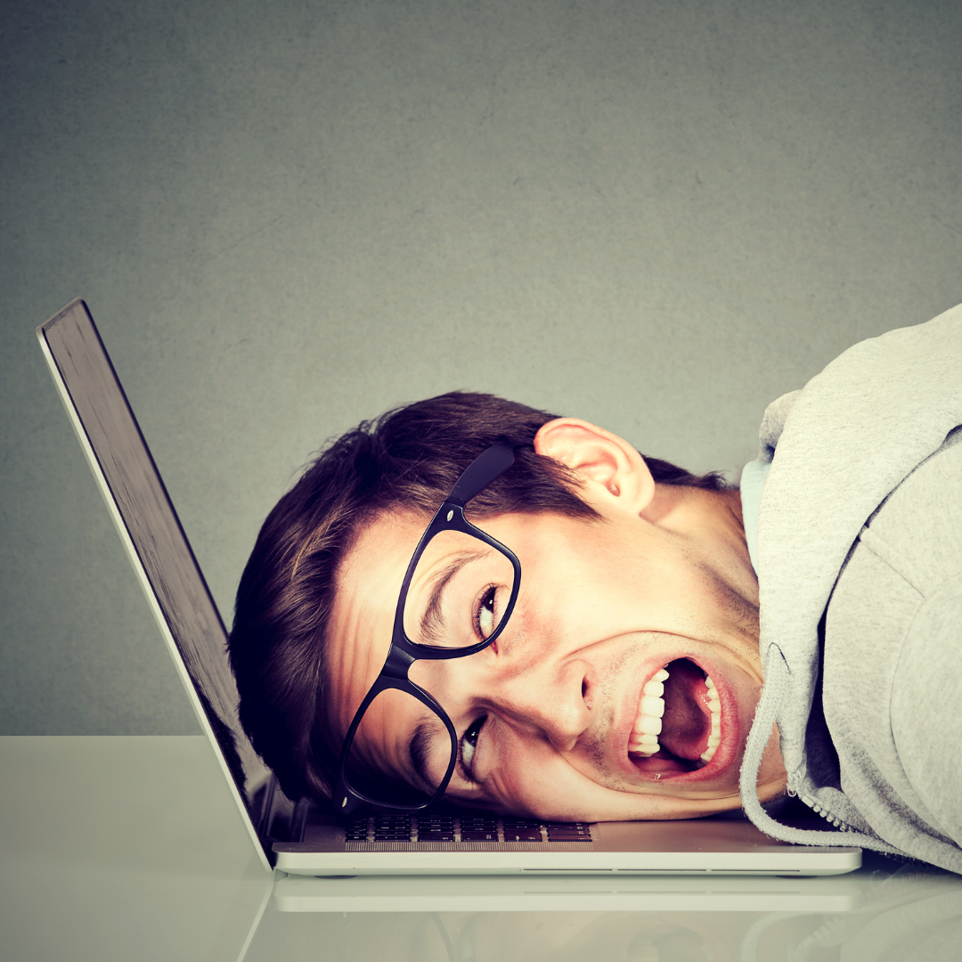 man upset at computer