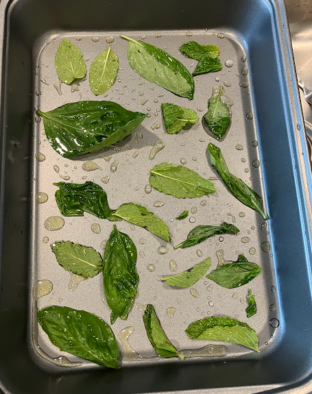 mint and olive oil in a baking pan