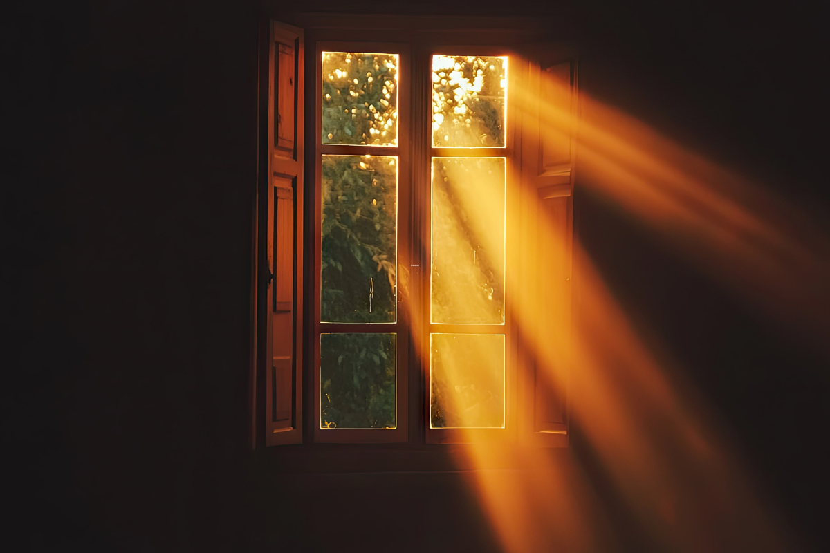 light shining through the window of a dark room