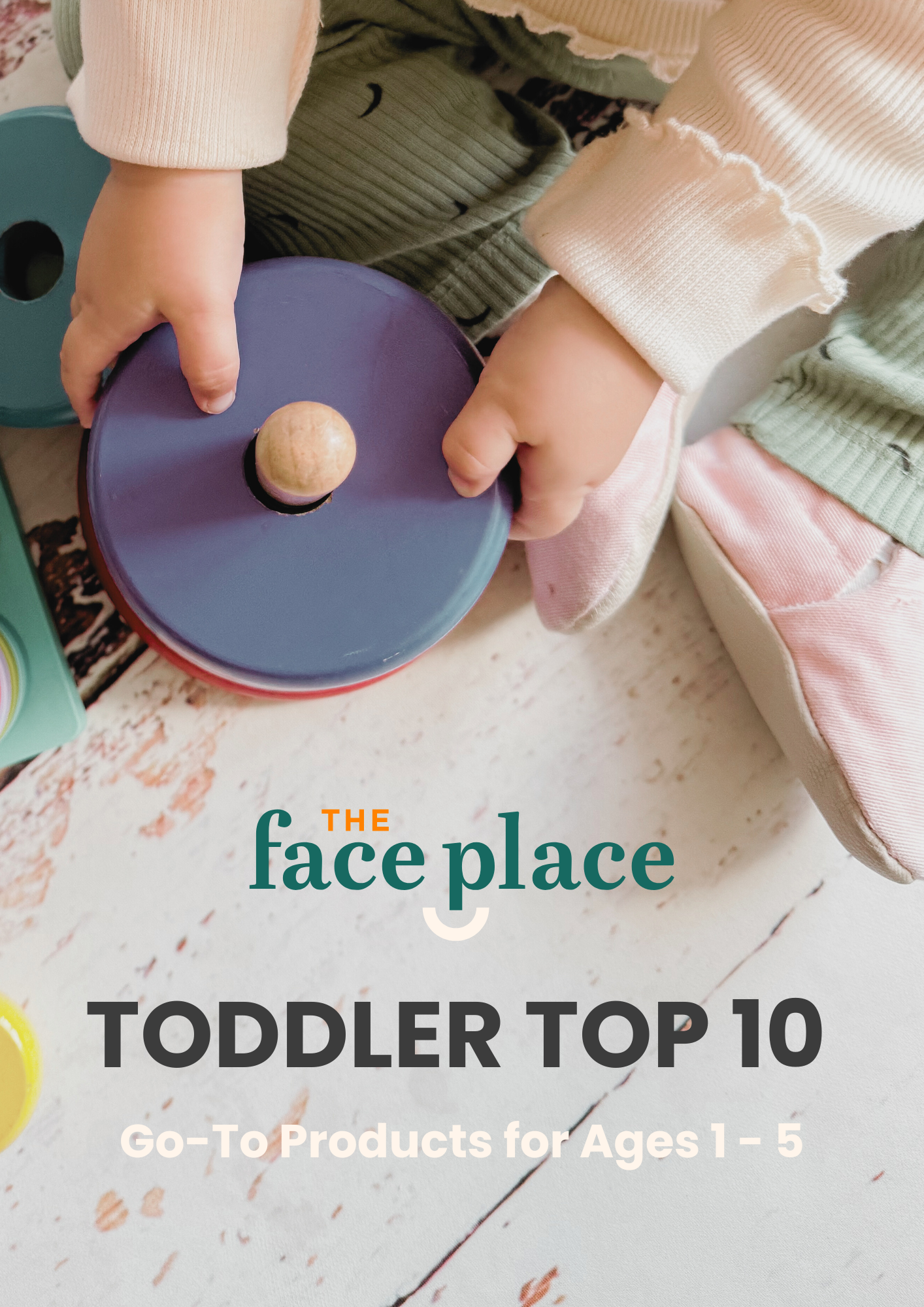 Toddler playing with wooden toy beside The Face Place Toddler Top 10 guide promoting go-to products for ages 1 to 5