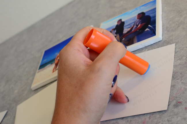 use glue to attach your photos to the coasters