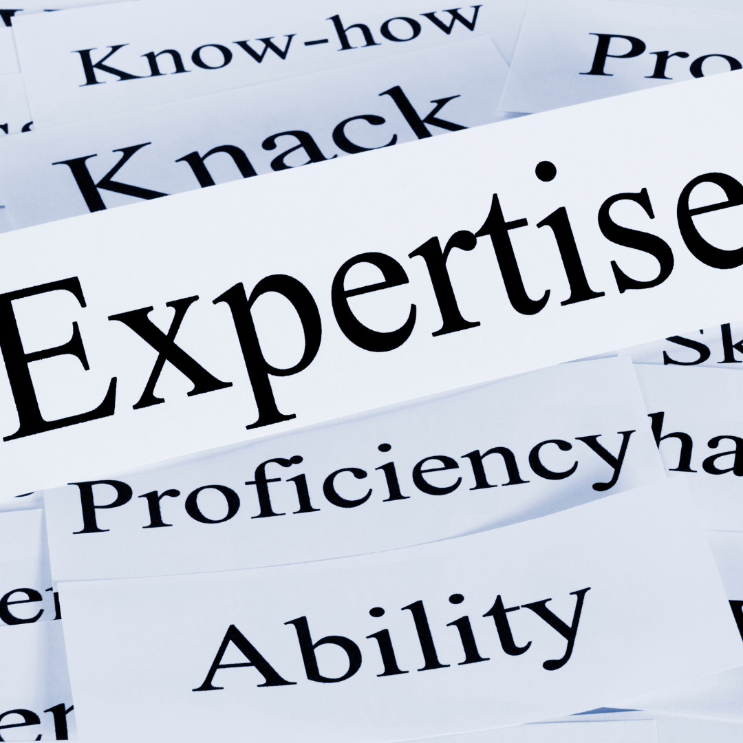 paper clippings with the word "Expertise" in focus