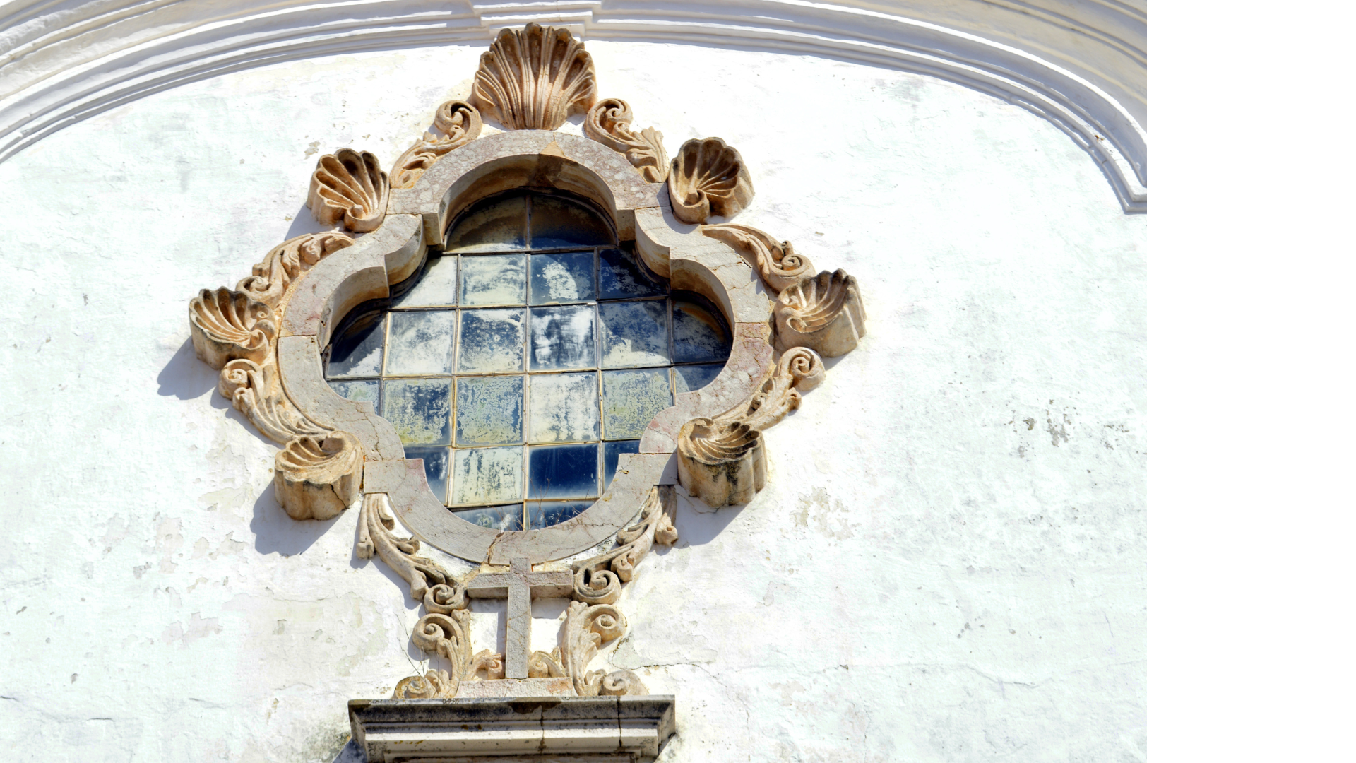 ornate stone and glass work on a church in Lagos, Portugal