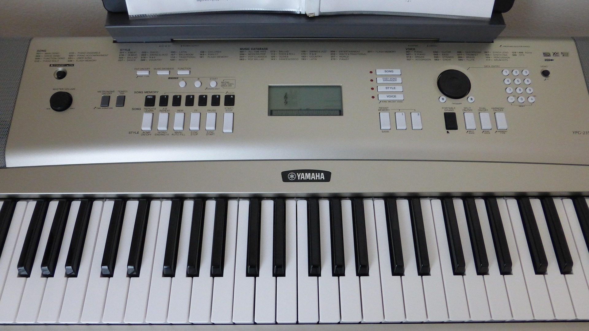 photo of silver electronic piano keyboard