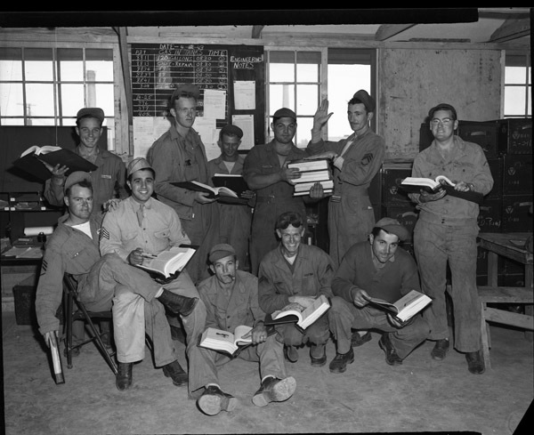 Engineering Crew Holds Manuals