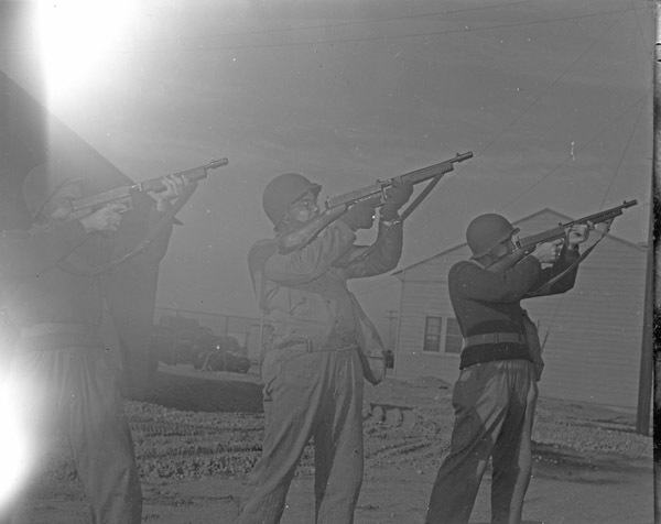 Soldiers Aim Rifles