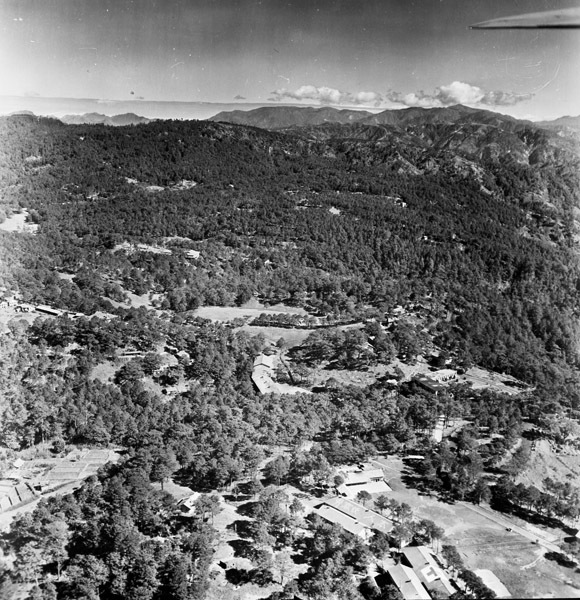 A small city surrounded by low hills.