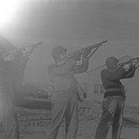 Soldiers Aim Rifles