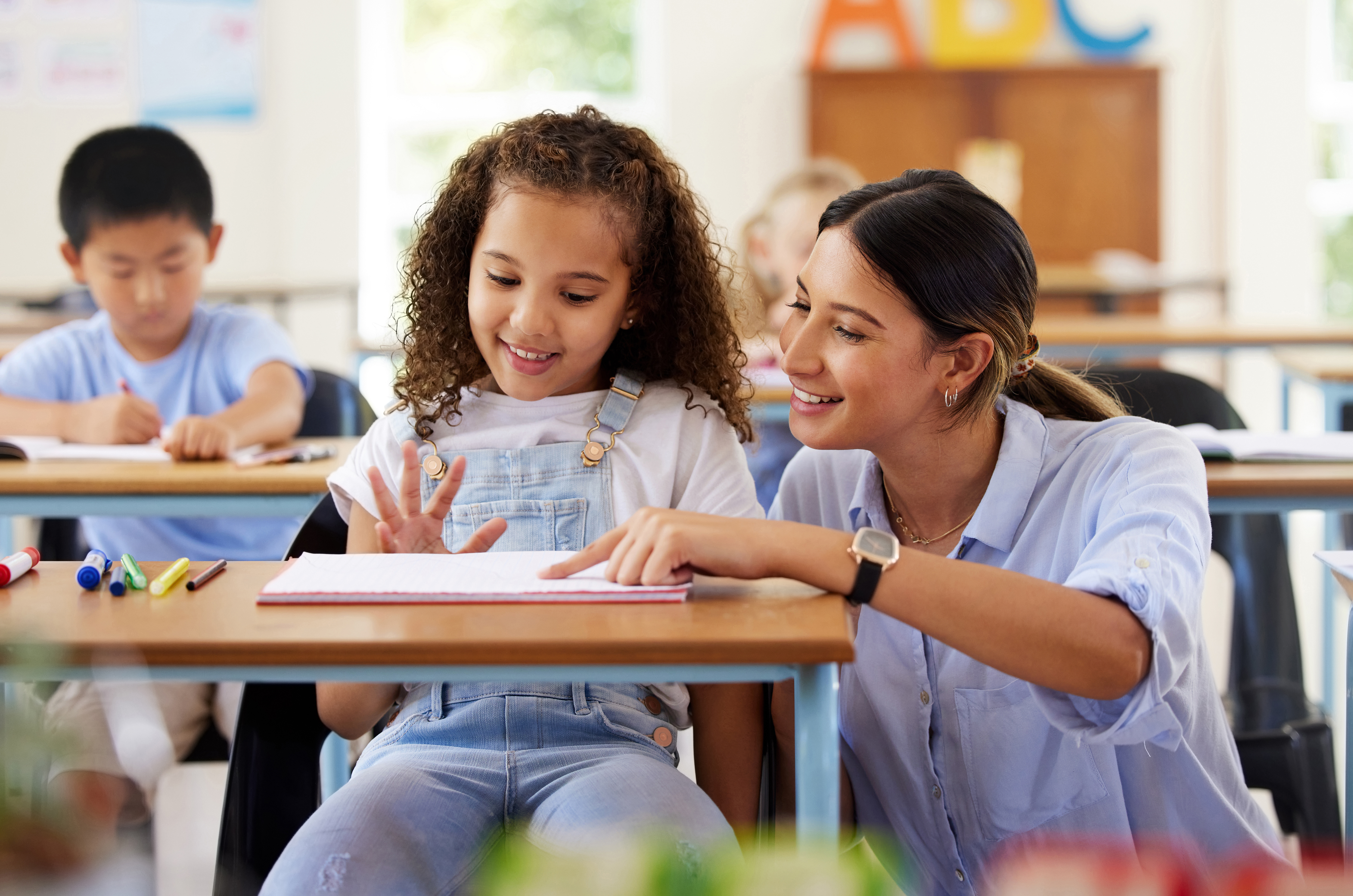 teacher helping student
