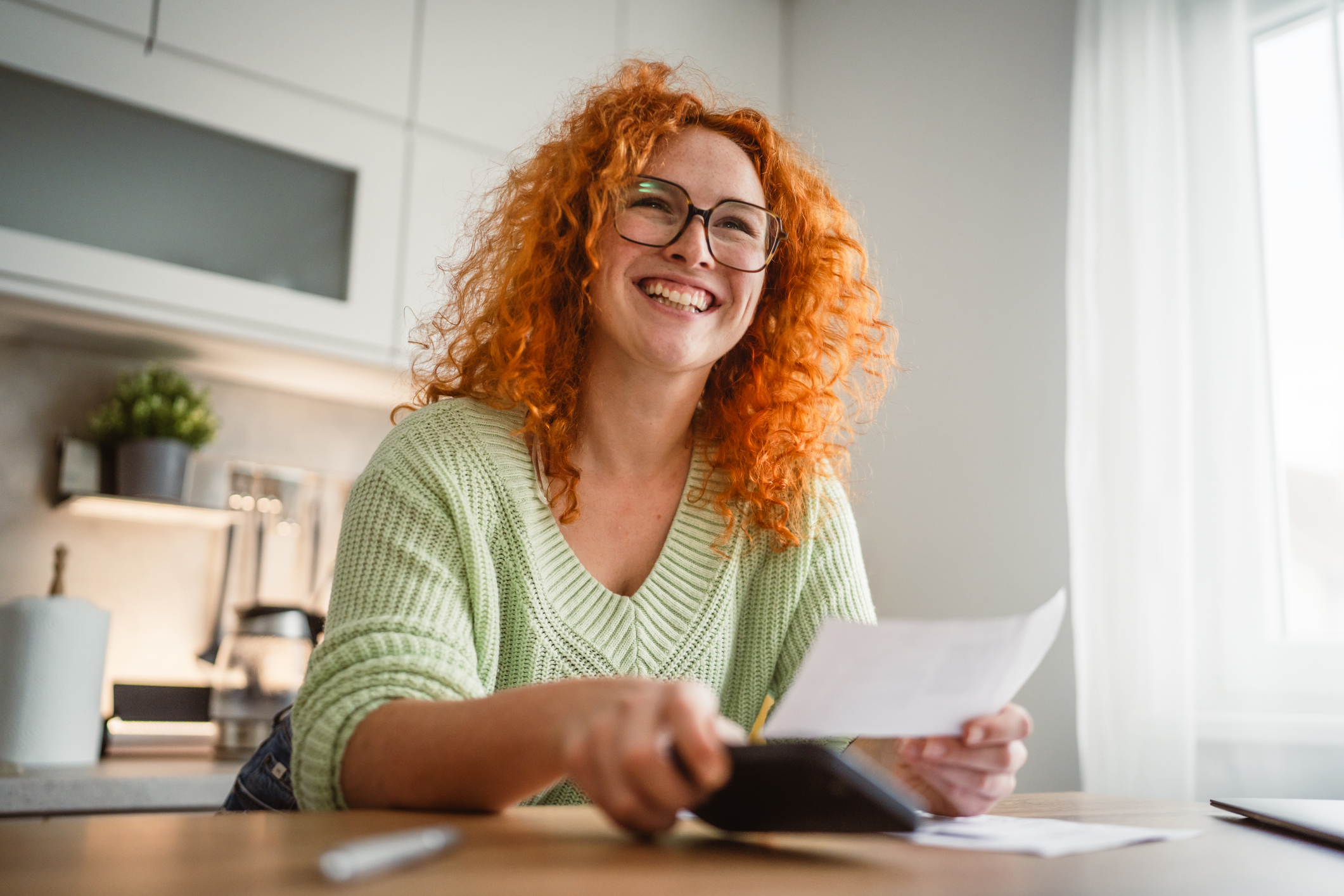 empowered person looking at bills