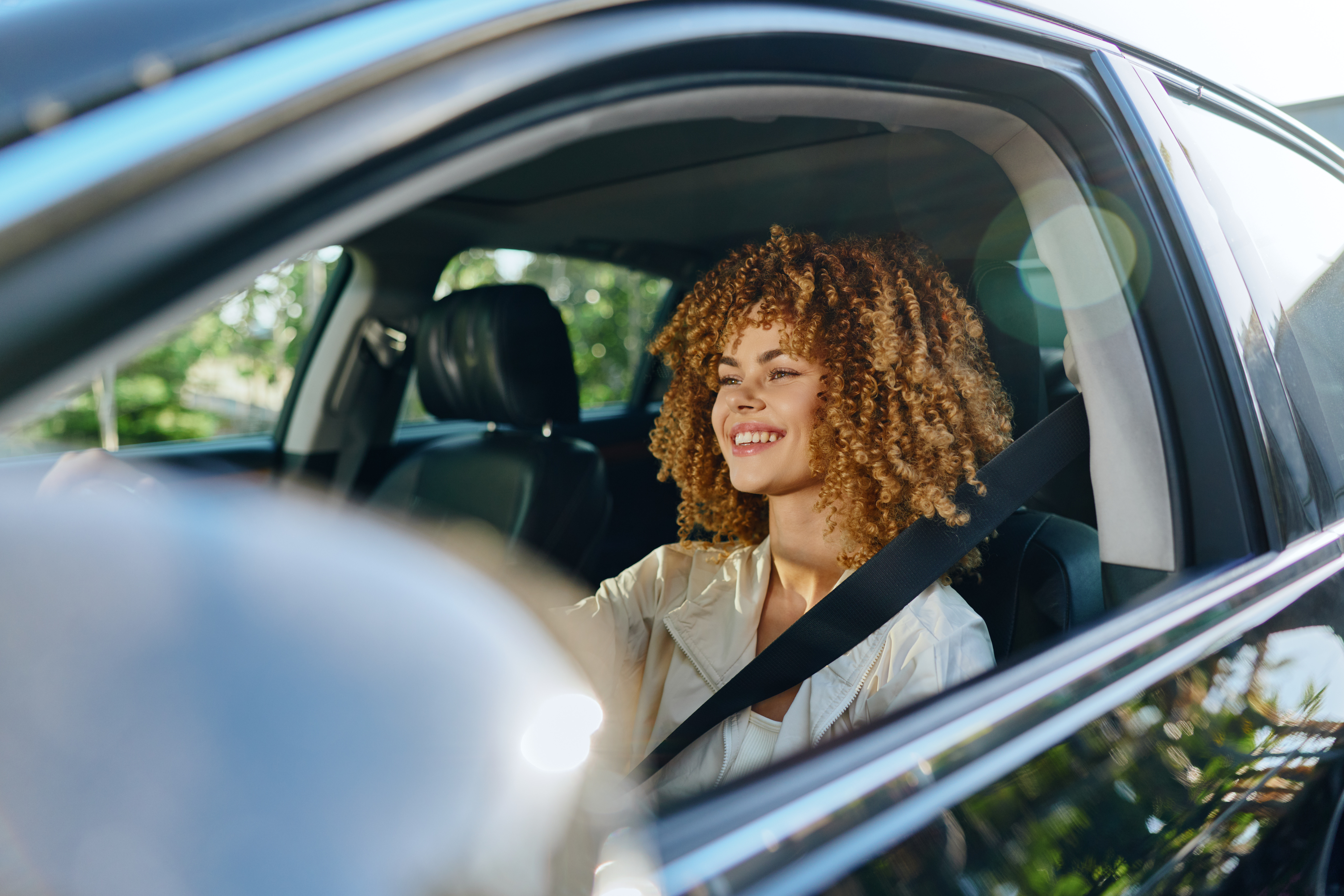 person in car enjoying ride