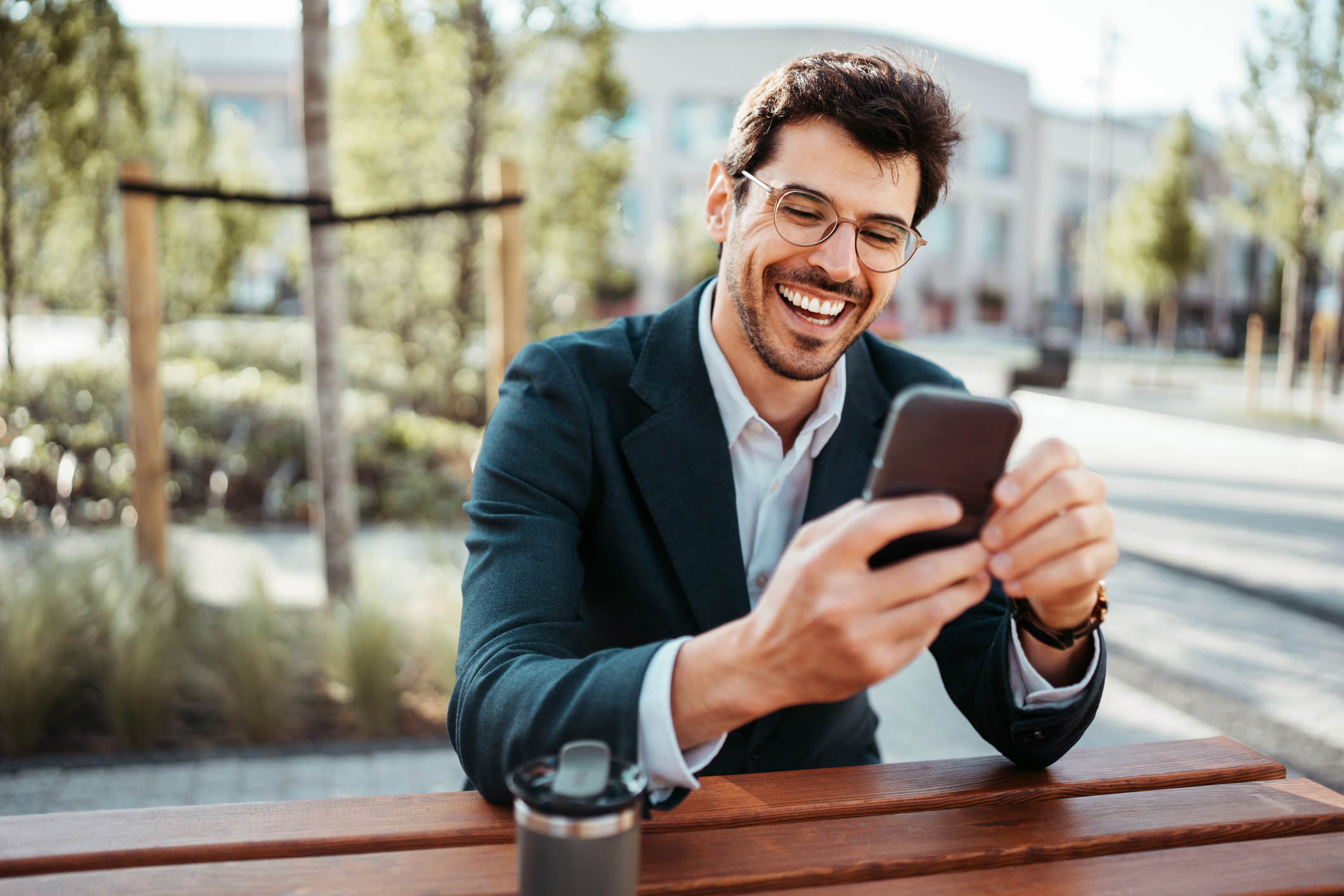 person on phone happy