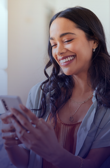 person happy looking at phone