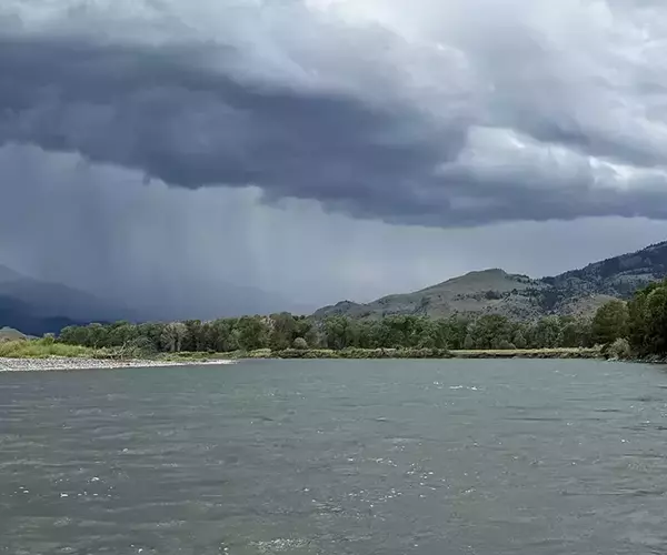 									Running from a storm while fly fishing montanas yellowstone river
															