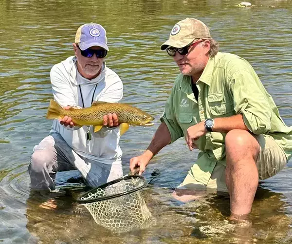 									Bozeman fly fishing trip guide and guest with july 2026 brown trout
															