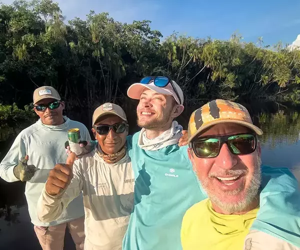 									Alex celebraing success while fly fsihing in brazil
															