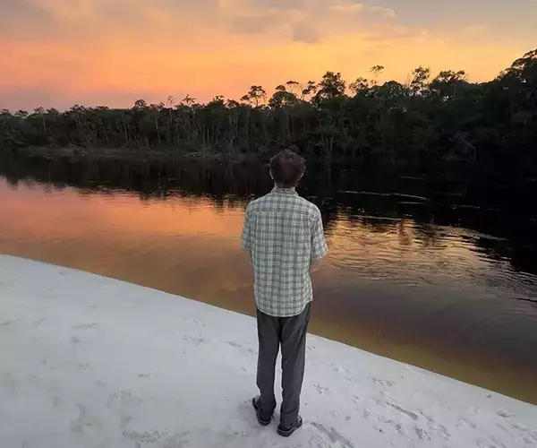 									Matty watching sunset while fly fishing in brazil
															