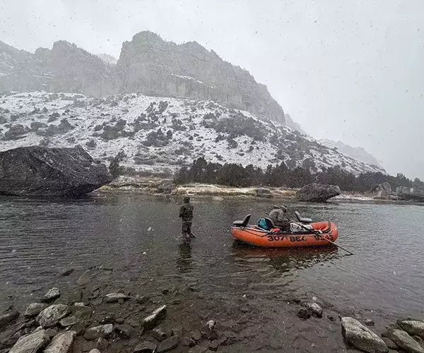 									Wind rvier fly fishing in snow
															