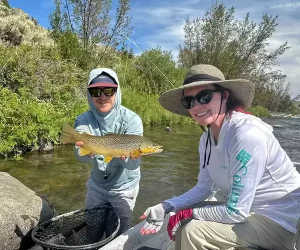 									Madison river fly fishing guide trip kk and guest with brown trout
															
