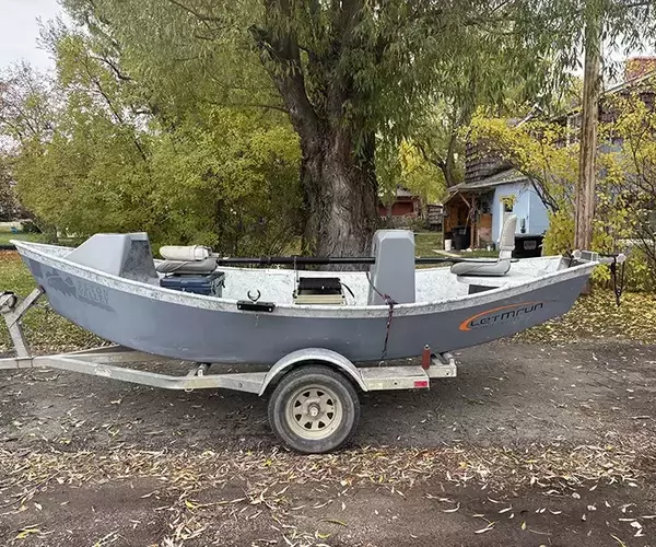 Bozeman fly fishing guide colman breckbill with a montana dirft boat
