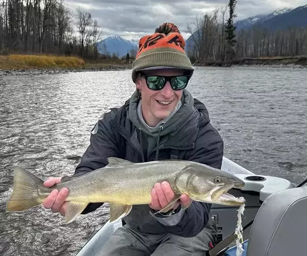 Jackson krause bozeman fly fishing guide with a bull trout