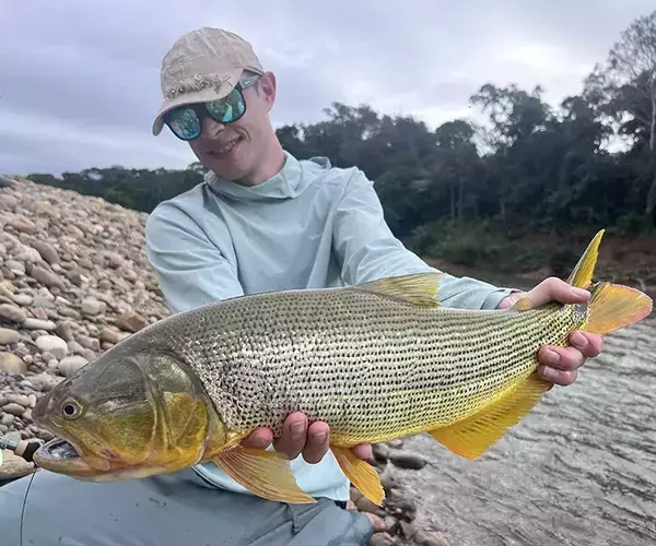 Bozemam fly fishing outfitter team alex swank with a golden dorado