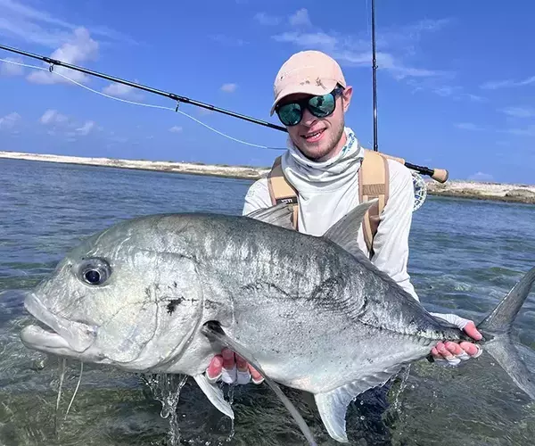 Bozeman mt fly fishing outfitter team alex swank with giant trevally