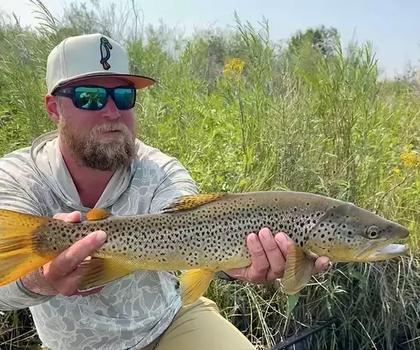 									Bozeman fly fishing trip brown trout and angler
															