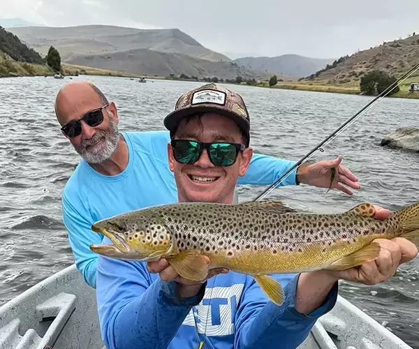 									Lower madison river montana fly fishing trip brown trout in hand
															