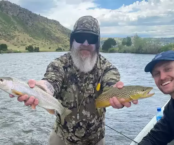 									Mike rainbow and brown trout double
															