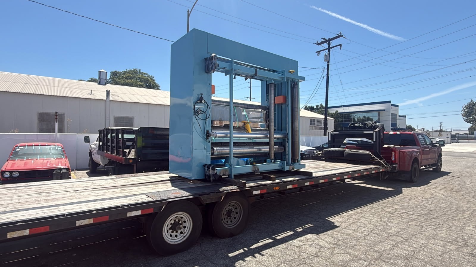 Paper-processing machine secured on a gooseneck flatbed trailer headed to El Paso!