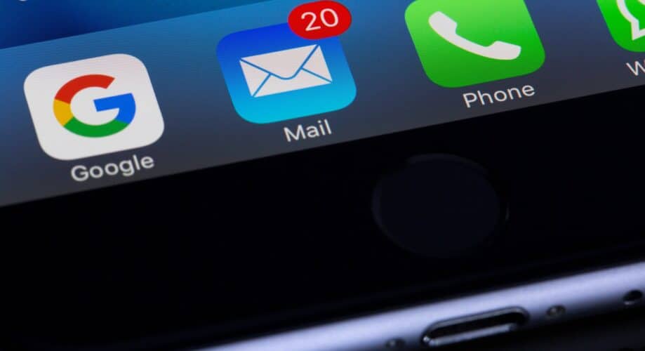 A smartphone screen displays app icons: Google, Mail with a red notification bubble showing "20," and Phone, against a black casing background.
