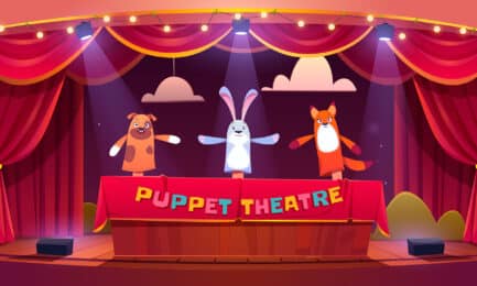 Digital image of puppet show theater with red curtains and animal-themed puppets.