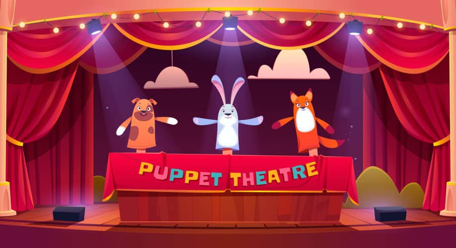 Digital image of puppet show theater with red curtains and animal-themed puppets.