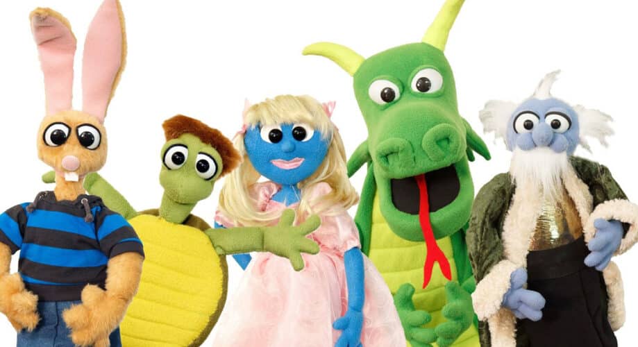 A group of puppet characters, including a princess and a dragon.