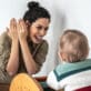Caregiver and toddler play peek-a-boo together